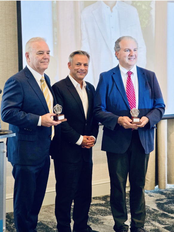 Neal Orringer, President of ASTRO America, pictured center, presents metal 3D-printed trophies to Rep. Jimmy Patronis (R-Fla.), pictured right, and Charles W. Rigdon, Chair of Triumph Gulf Coast, pictured left, in recognition of their contributions to Northwest Florida’s aerospace and defense industry.