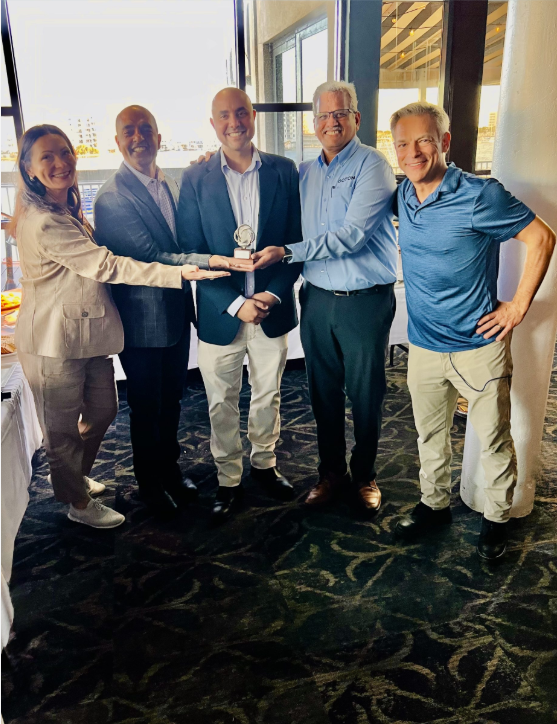 Pictured left to right: Kristina Sergueeva, Corporate Development, Oqton; Steve Lokam, CEO, Oqton; Abdalla Nassar, Director and General Manager, ASTRO South, Sridharan Hariharan, VP of Sales & Customer Success, Oqton, Neal Orringer, President, ASTRO America, following the presentation of a metal 3D-printed trophy at the 2nd Annual ASTRO-InSPIRE Tech Showcase in Destin, Florida.