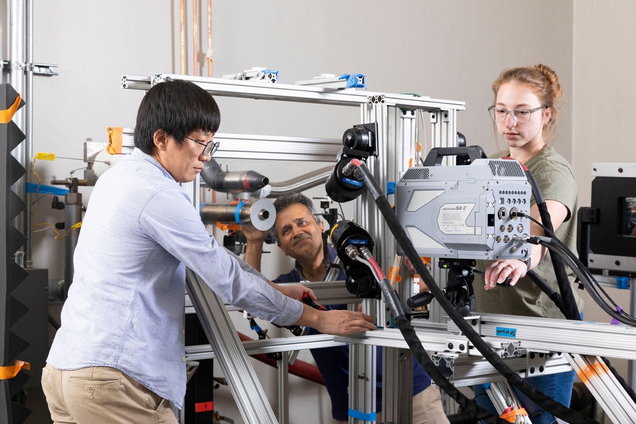 Postdoc MyungJun Song, Farrukh Alvi, Ph.D., and doctoral student Allie Gagne work in the Short Takeoff and Vertical Landing (STOVL) lab at the Florida Center for Advanced Aero-Propulsion (FCAAP) in the Aero-Propulsion Mechatronics & Energy (AME) building at FAMU-FSU College of Engineering in Tallahassee, Florida. (Scott Holstein/FAMU-FSU College of Engineering)